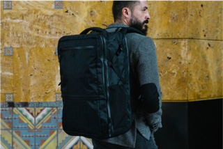 A man wearing a Tortuga backpack